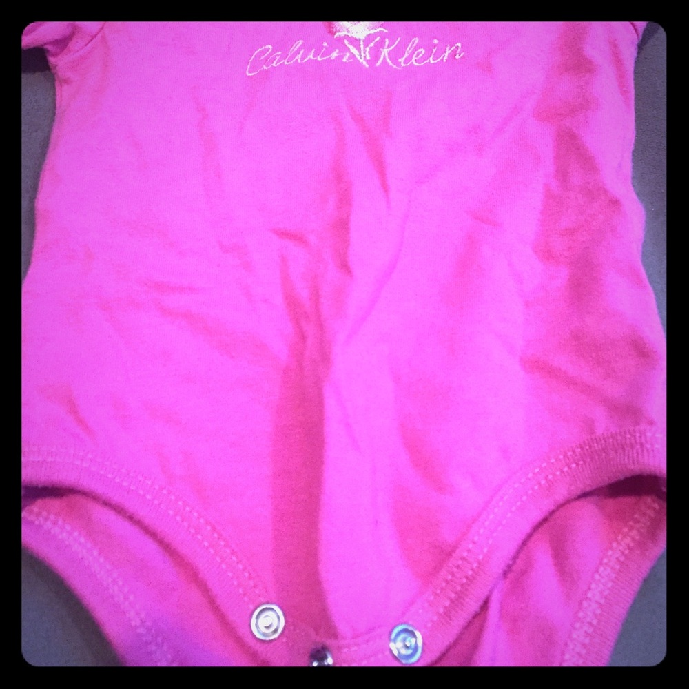 Pink Calvin Klein onesie